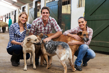 group of farm workers with dogs