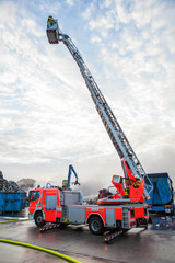 Fire truck with a cherry picker or elevated cage