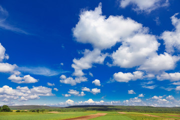 rural landscape with blue sky and clouds