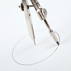 pair of compasses drawing circle