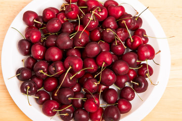 White Plate of Fresh Red Cherries