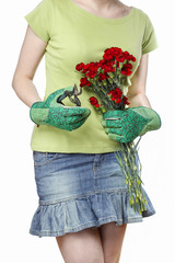 Florist holding bouquet of red carnations and garden shears.