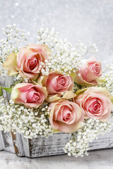 Beautiful pink roses and Gypsophila (Baby's-breath flowers)