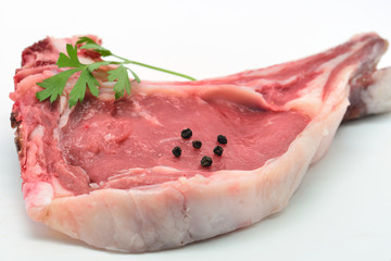 One raw beef rib eye isolated in white. European entrecote