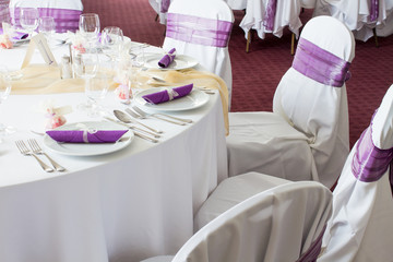 holiday table setting, purple napkin on plate - close up