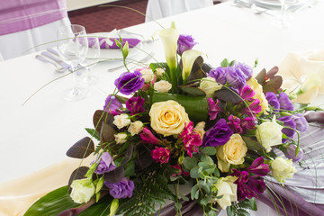 table set for wedding dinner decorated with flowers