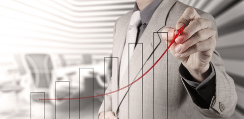 businessman hand draws business success chart