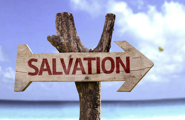 Salvation wooden sign with a beach on background