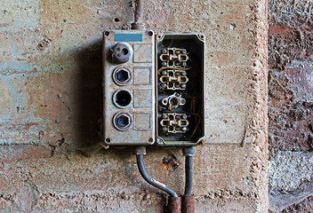 Fototapeta na wymiar Old electrical panel on concrete wall