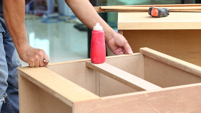 carpenter used air-gun for make new furniture 