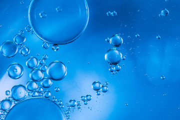 Abstract bubbles of oxygen floating towards the surface