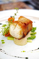 close up salmon steak in white dish