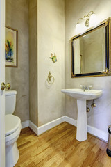 Light grey bathroom with white washbasin stand