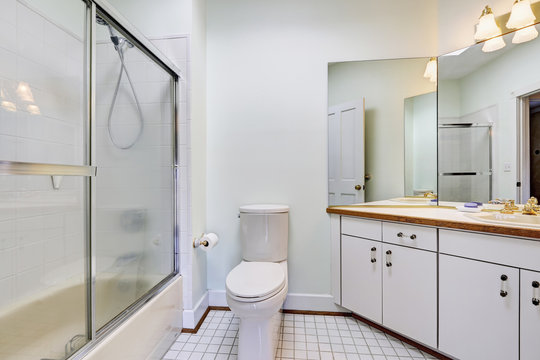Simple bathroom interior with glass door shower