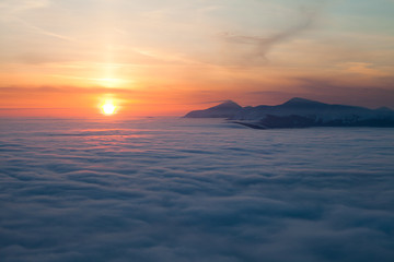 Fototapeta premium Peaks above clouds
