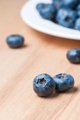 Fresh blueberries on the wooden table.