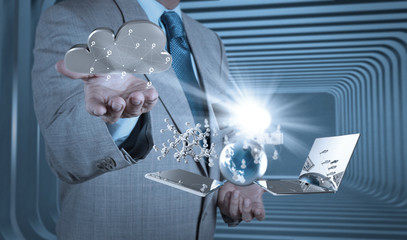 Businessman working with a Cloud Computing diagram on the new co