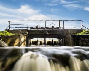 Water gate in the system of lakes in Peterhof on a sunny day