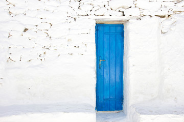 blue door in a greek island of Mykonos