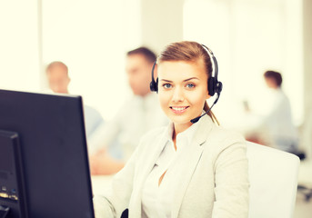 helpline operator with headphones in call centre