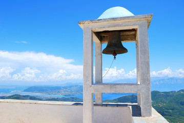 Small belfry with an old bell watching over Lefkada island