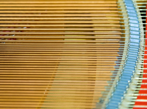 igold strings inside of a piano