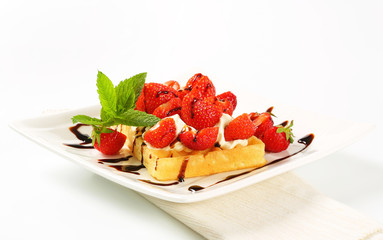 Crisp waffle with  strawberries and cream