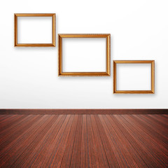 Golden picture frames on the wall inside the room