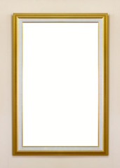 Gold frame on beige wall