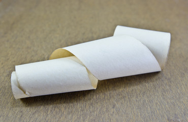 old paper rool on wood background