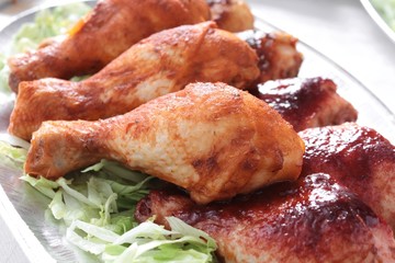 buffet chicken drumsticks on platter,
