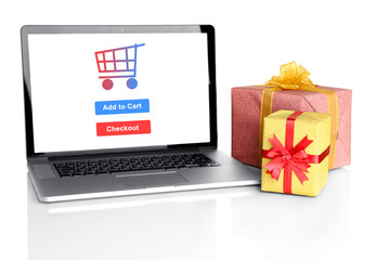 Concept for Internet shopping: laptop and gifts isolated