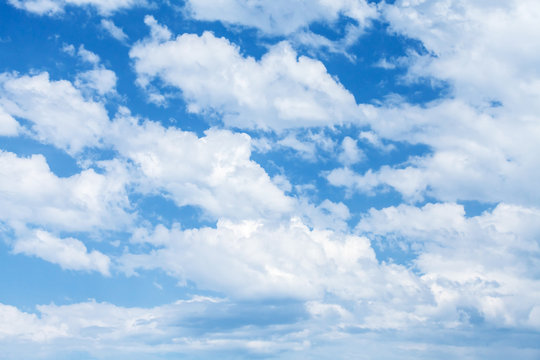 Bright blue cloudy sky background photo texture