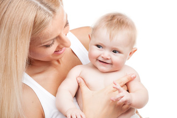 happy mother holding smiling infant.