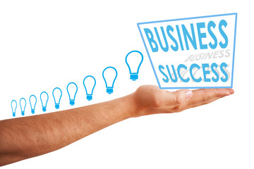 Hand holding light bulbs and a box with business success