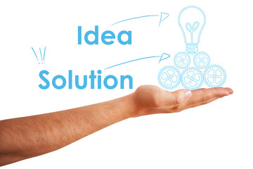 Hand holding a light bulb