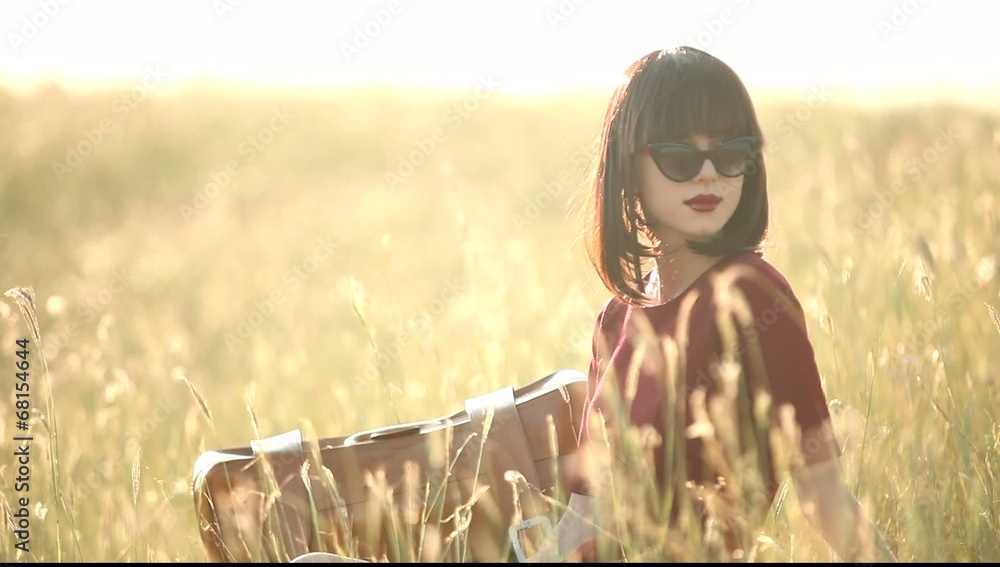 Sticker brunette girl on the grass in autumn time