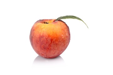 Studio shot of whole fresh peach isolated on a white background