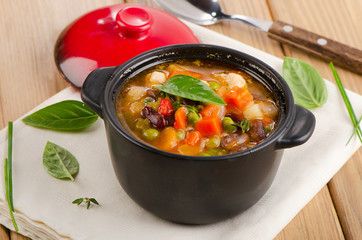 Bowl of minestrone soup  with beans and vegetables.