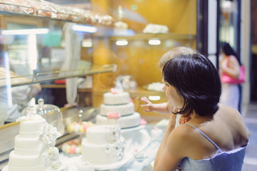Mother and Daughter Looking at Cakes