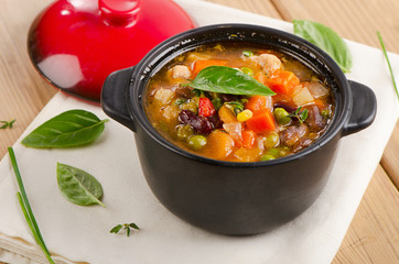 Bowl of minestrone soup  with beans and vegetables.