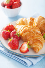 fresh croissants with jam and strawberry for breakfast