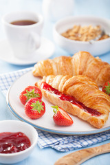 fresh croissants with jam and strawberry for breakfast