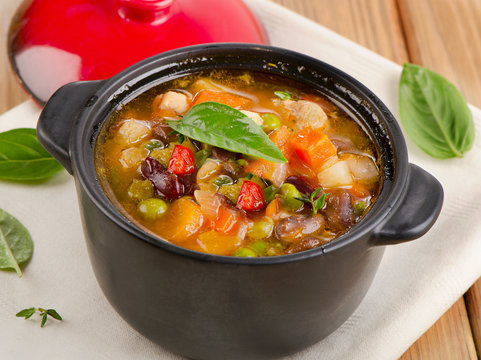Bowl of minestrone soup  with beans and vegetables.