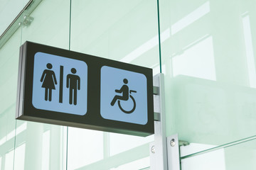 Public restroom signs with a disabled access