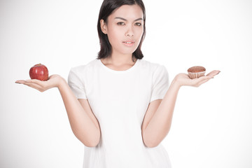 Smiling woman with apple isolated on white