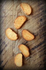 Vintage photo of rusks on wooden table
