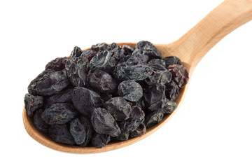 raisins fruit in spoon on white
