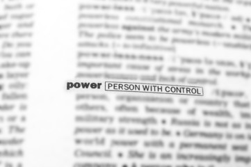 Blurred text in dictionary with focus on POWER.