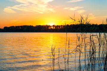 Beautiful sunset. The sun sets over the lake